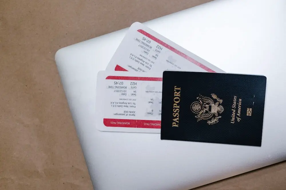 Passport and boarding passes on a laptop